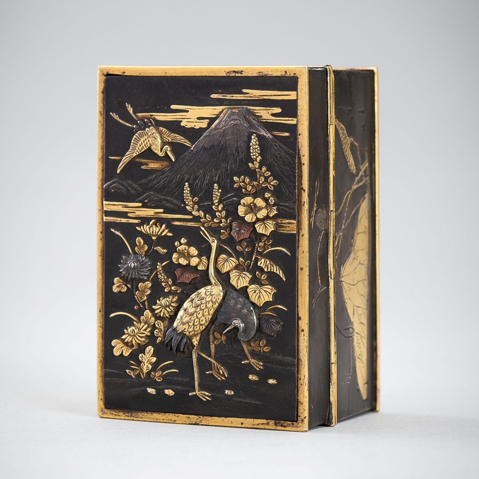 A SMALL MIXED-METAL INLAID BOX WITH CRANES BENEATH MOUNT FUJI (1 of 14)