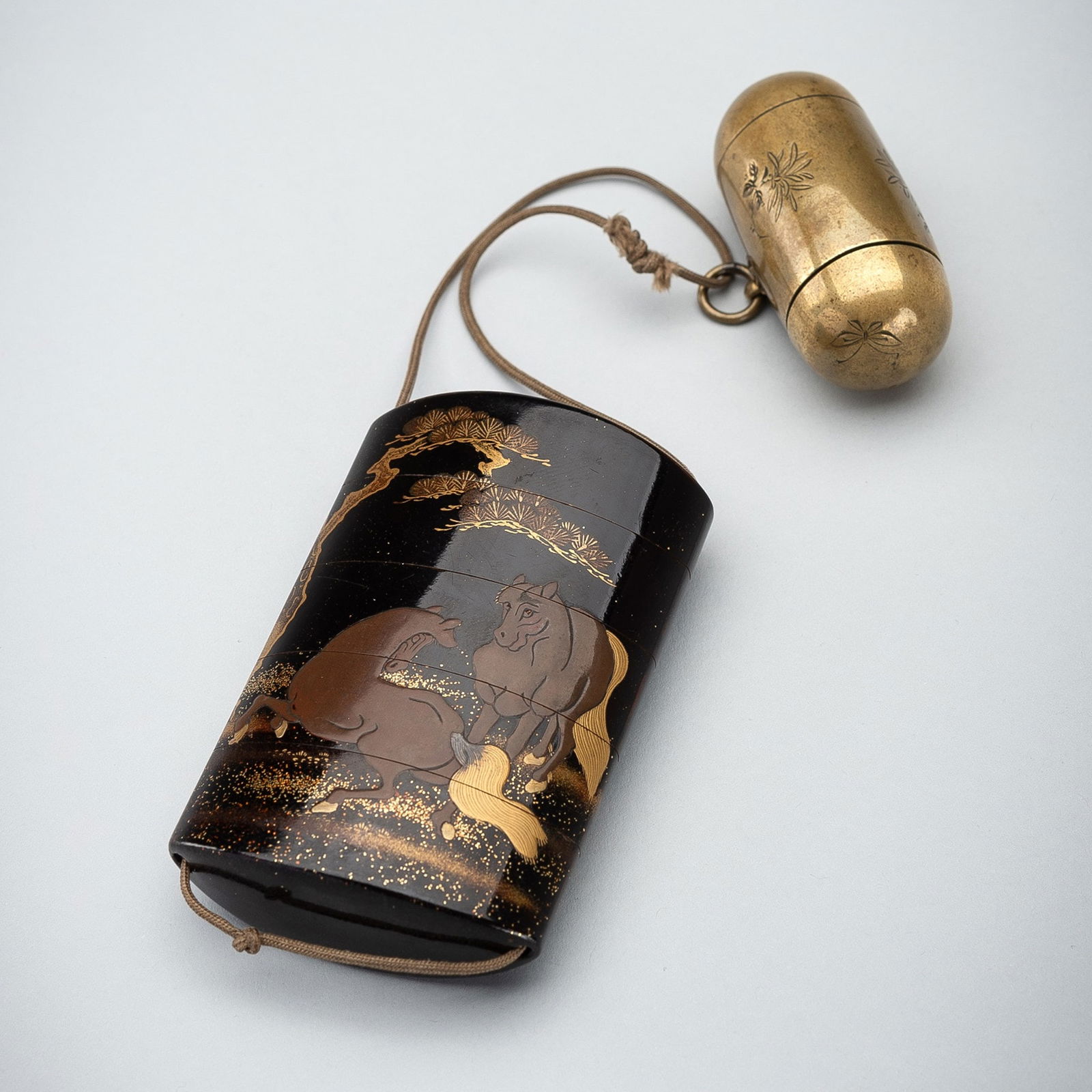 A FOUR-CASE LACQUER INRO WITH HORSES AND A BRASS NETSUKE (1 of 13)