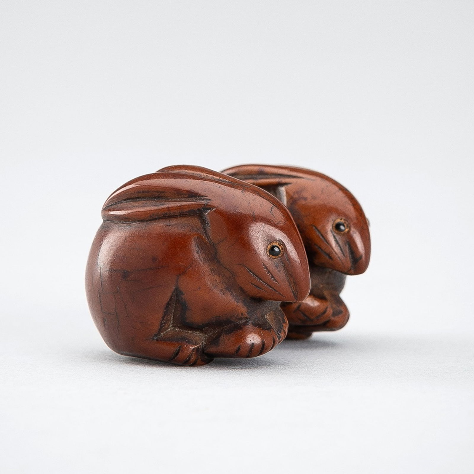 A COROZO NUT NETSUKE OF TWO RABBITS (1 of 13)