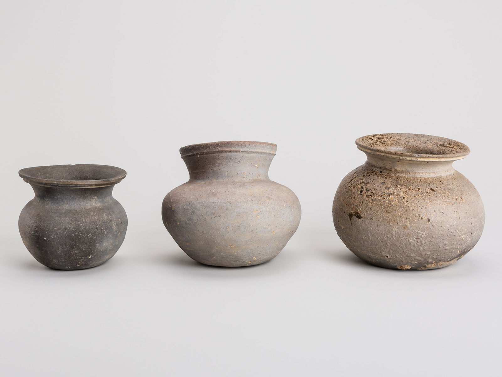 A GROUP OF THREE KOREAN POTTERY JARS, THREE KINGDOMS PERIOD (1 of 8)