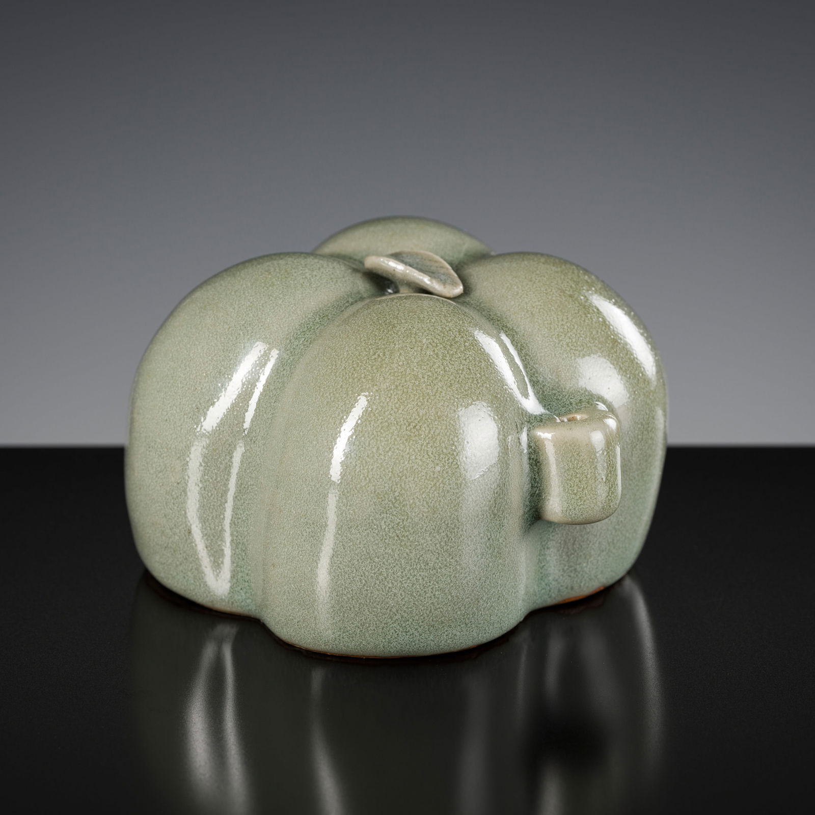 A CELADON-GLAZED 'PUMPKIN' WATER DROPPER, JOSEON DYNASTY (1 of 10)