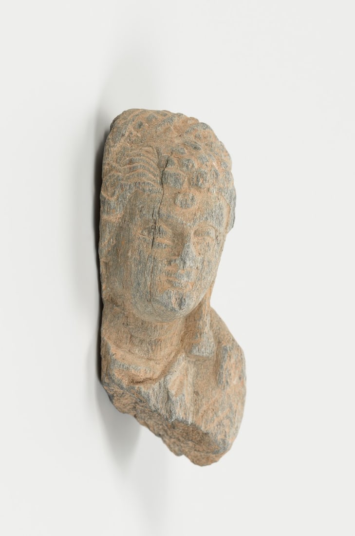 A GANDHARAN GRAY SCHIST HEAD OF A DEITY, 5TH-7TH CENTURY (1 of 8)