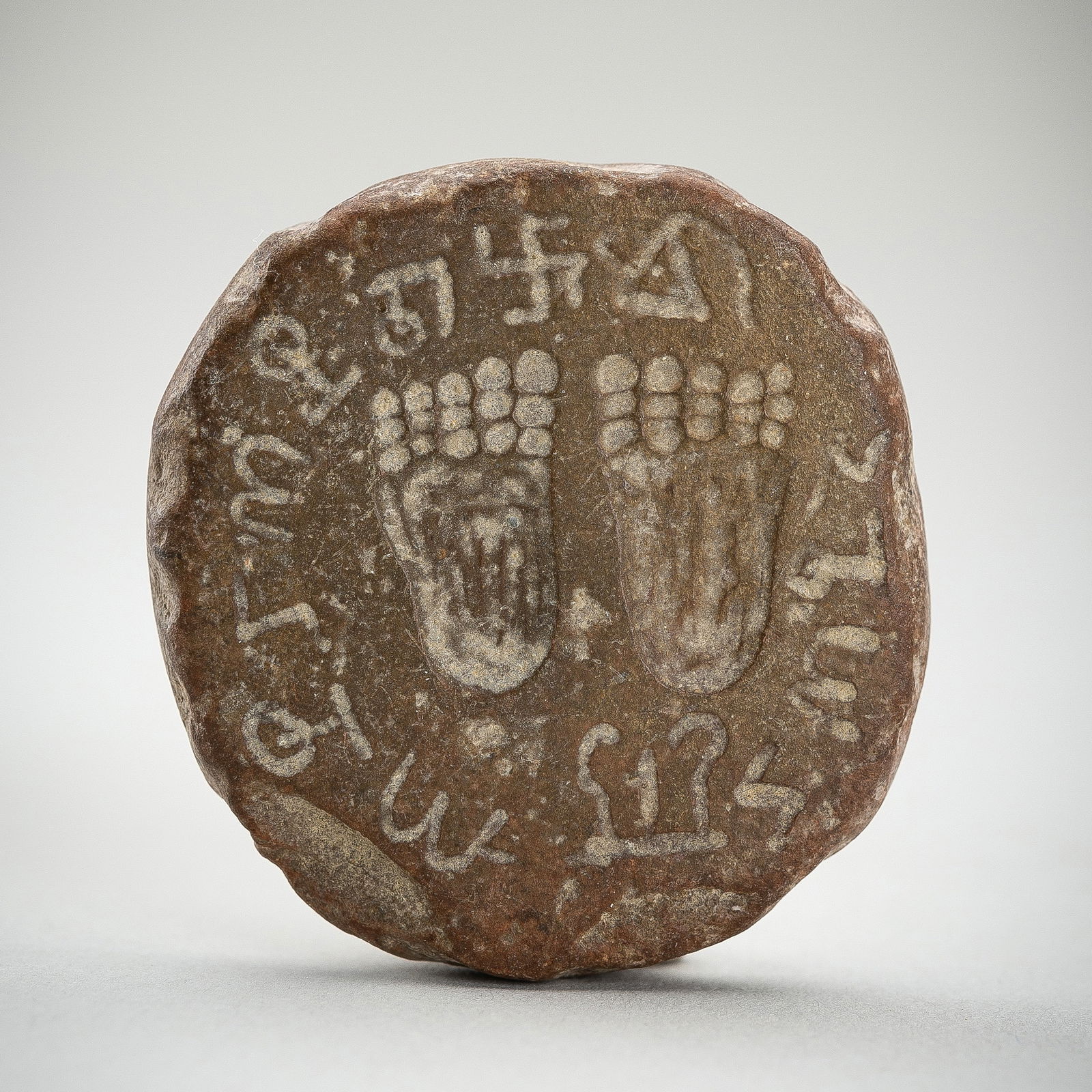 A WESTERN ASIATIC STONE INTAGLIO PLAQUE WITH BUDDHA FEET, 5TH-7TH CENTURY (1 of 10)