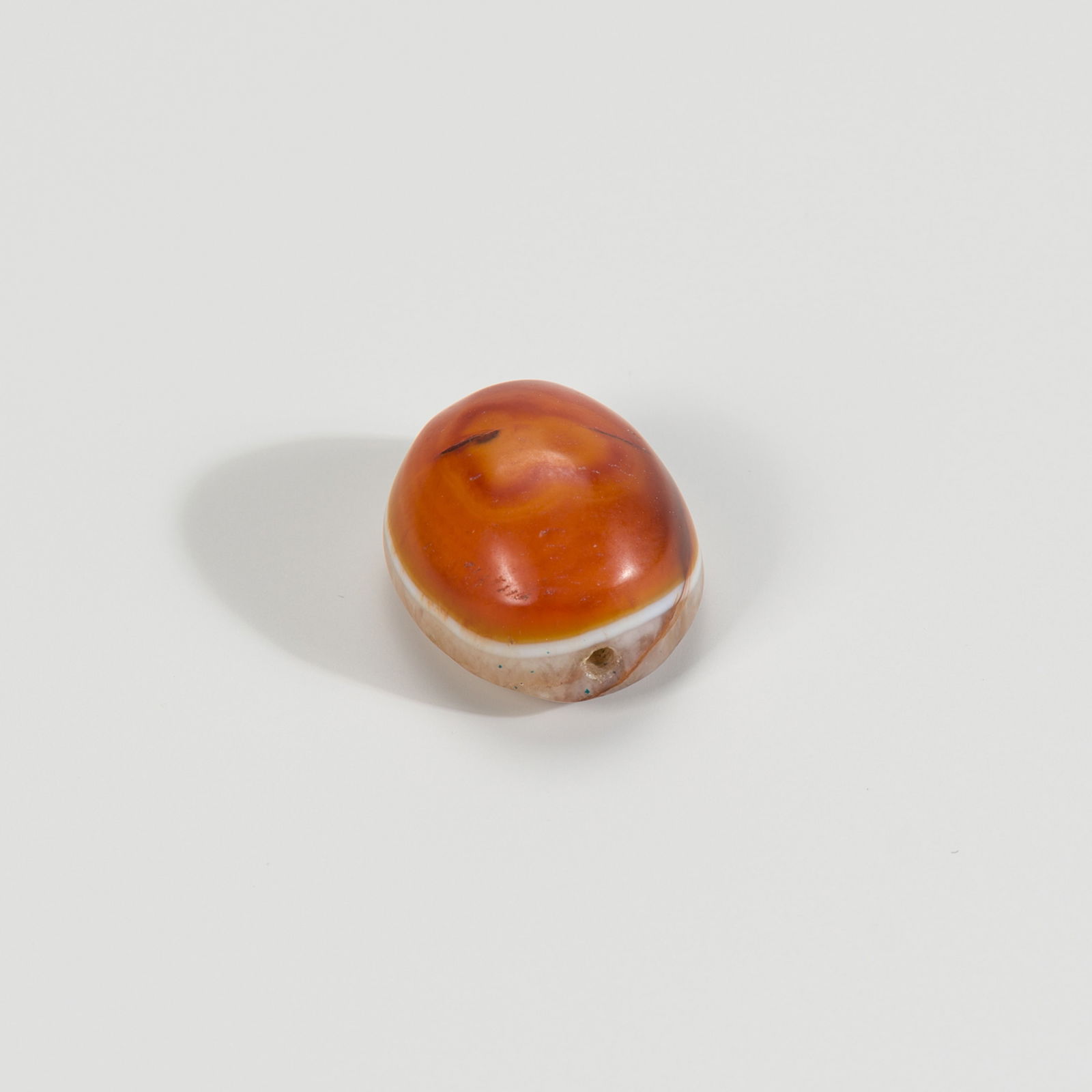 A TIBETAN AGATE BUDDHA EYE BEAD, 19TH CENTURY OR EARLIER (1 of 5)