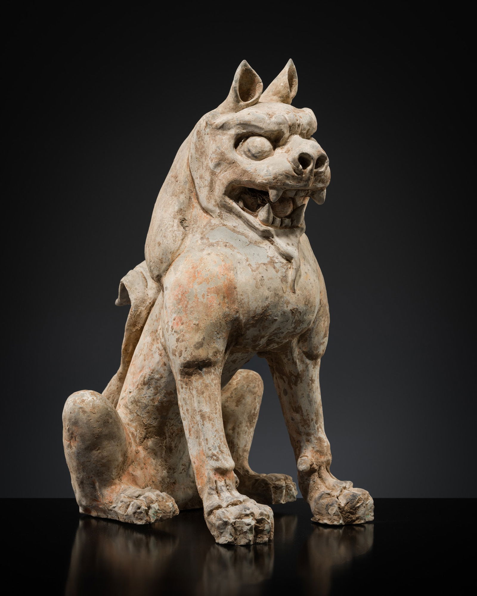 A RARE PAINTED POTTERY FIGURE OF A GUARDIAN LION, TANG DYNASTY (1 of 15)