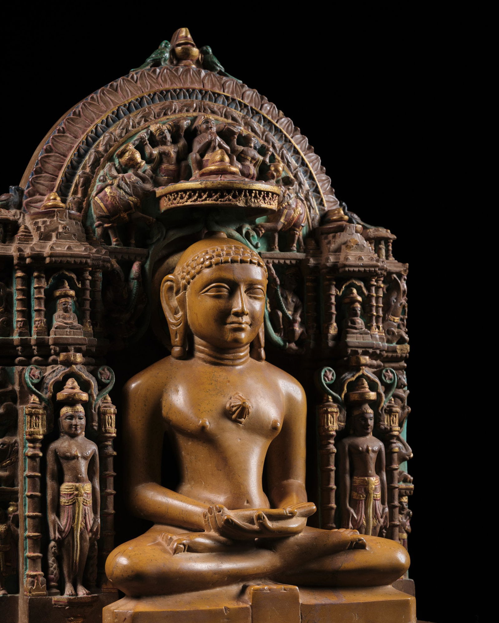 A JAIN LIMESTONE FIGURE OF AJITHANATHA WITH ITS MATCHING PAINTED AND GILT-DECORATED SHRINE (1 of 16)
