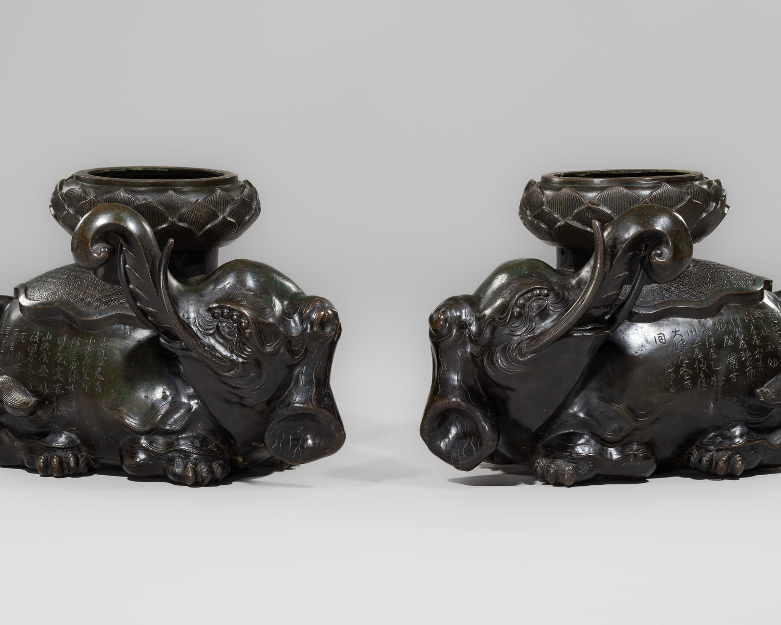 A LARGE PAIR OF BRONZE 'BUDDHIST ELEPHANT' ALTAR VASES, DATED 1739 (1 of 17)
