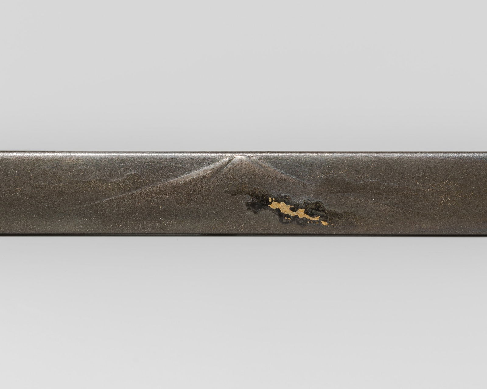 JOKA: A RARE LACQUERED SHIBUICHI KOZUKA DEPICTING MOUNT FUJI, AFTER KANO TAN'YU: JOKA: A RARE LACQUERED SHIBUICHI KOZUKA DEPICTING MOUNT FUJI, AFTER KANO TAN'YU By the Joka family, signed Tan'yusai zu, Joka and kakihanJapan, 19th century, Edo period (1615-1868)The shibuichi kozu