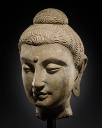 A LARGE STUCCO HEAD OF BUDDHA, GANDHARA, 3RD CENTURY