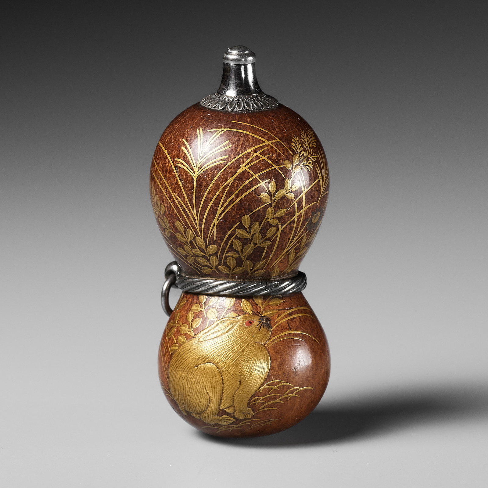 A FINE AND LARGE LACQUERED GOURD NETSUKE WITH A CHUBBY HARE AMONGST AUTUMN GRASSES (1 of 12)