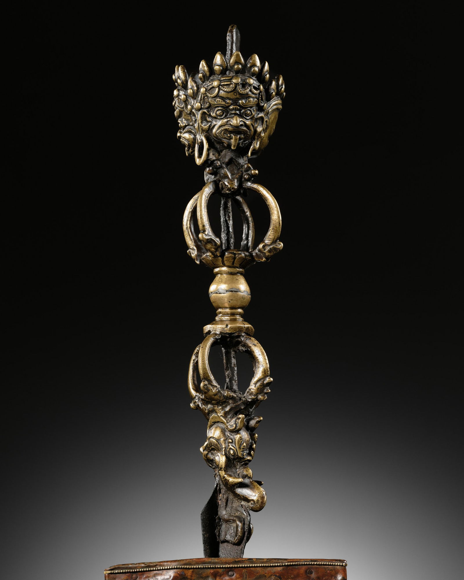 A LARGE IRON AND BRONZE PHURBU WITH WOOD LOTUS BASE, 18TH-19TH CENTURY (1 of 17)