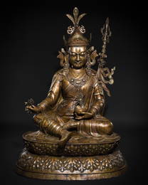 A HIGHLY IMPORTANT AND MONUMENTAL (167 CM) INLAID BRONZE FIGURE OF GURU RINPOCHE, PADMASAMBHAVA,