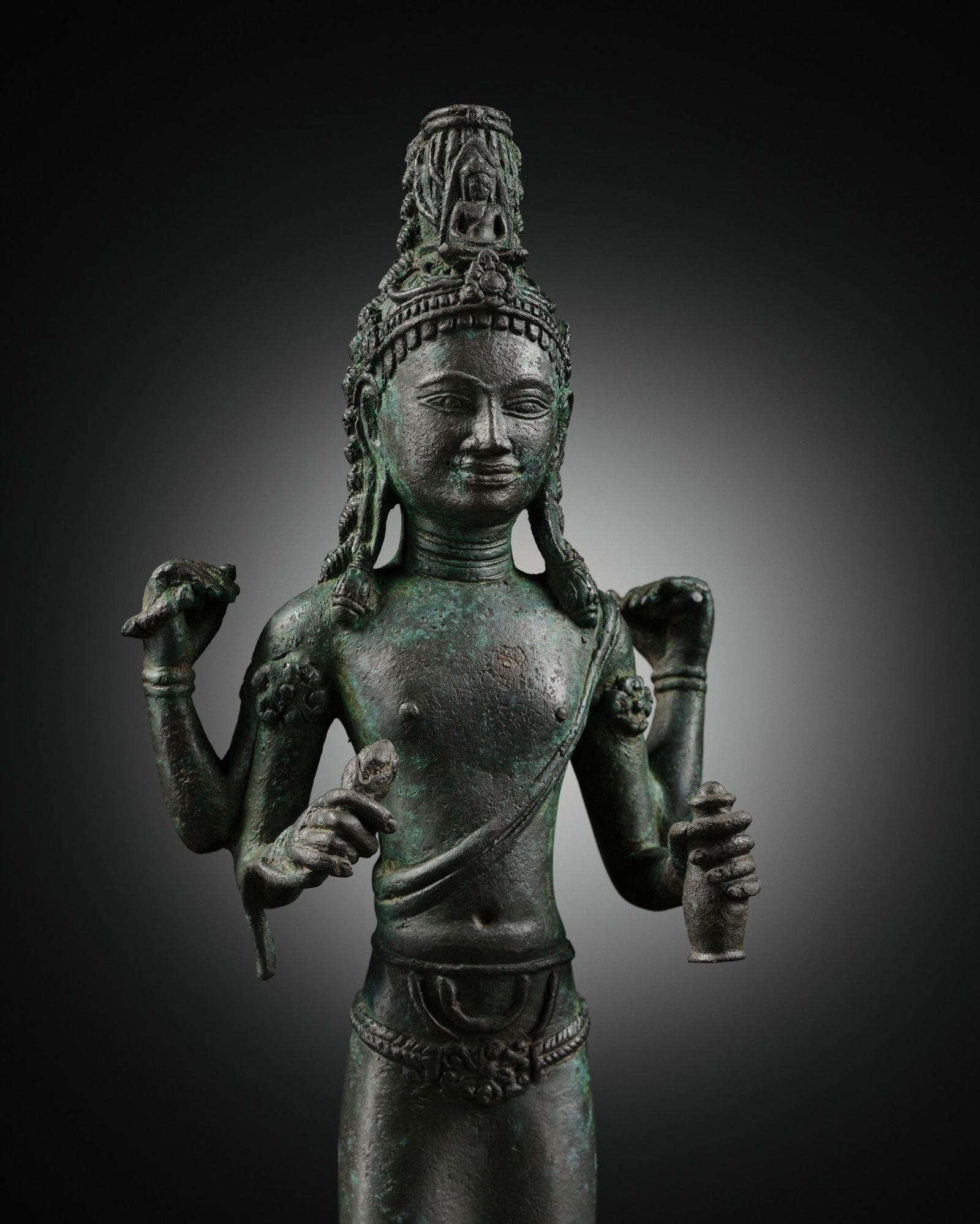 A BRONZE FIGURE OF AVALOKITESHVARA, SRIVIJAYA, 8TH-EARLY 9TH CENTURY (1 of 12)