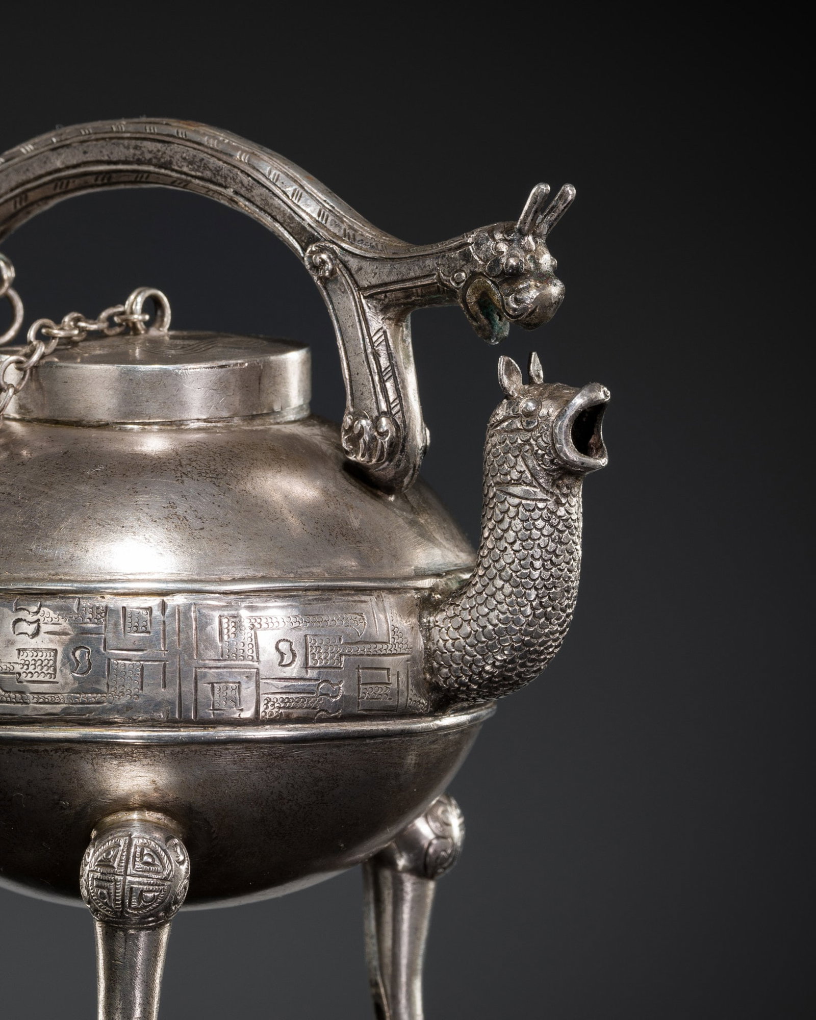 AN ARCHAISTIC SILVER MINIATURE WINE EWER AND COVER, HE, LATE QING DYNASTY: AN ARCHAISTIC SILVER MINIATURE WINE EWER AND COVER, HE, LATE QING DYNASTY Published & Exhibited: Ben Janssens Oriental Art, In Scholar's Taste, London, 3-12 November 2016, p. 58-59, no. 27 (part-l