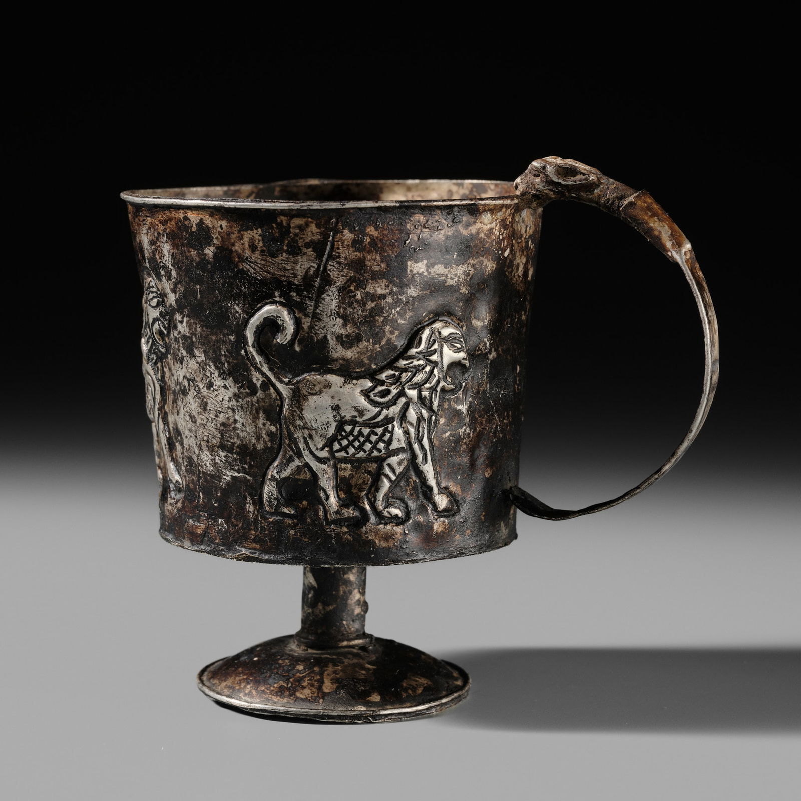 A PERSIAN SILVER REPOUSSE 'LION' CUP, IRAN, PROBABLY FIRST MILLENNIUM BC (1 of 14)