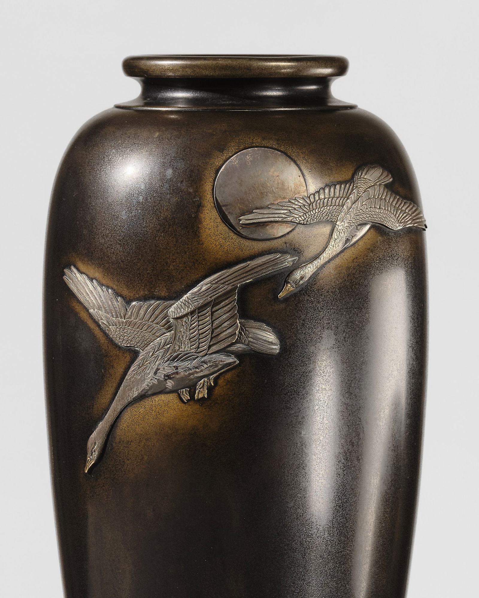 KAZUYOSHI FOR THE NOGAWA COMPANY: A LARGE INLAID BRONZE VASE WITH GEESE AND FULL MOON: KAZUYOSHI FOR THE NOGAWA COMPANY: A LARGE INLAID BRONZE VASE WITH GEESE AND FULL MOON By Kazuyoshi for the Nogawa company, signed Kazuyoshi and with the Nogawa company markJapan, Meiji period (1868-19