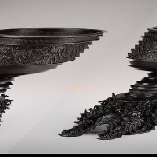 A SIGNED BRONZE KORO (INCENSE BURNER): A SIGNED BRONZE KORO (INCENSE BURNER) SignedJapan, 19th century, Meiji period (1868-1912)The bowl rests on a separately cast stand intricately worked with crashing waves, finely incised and detailed w