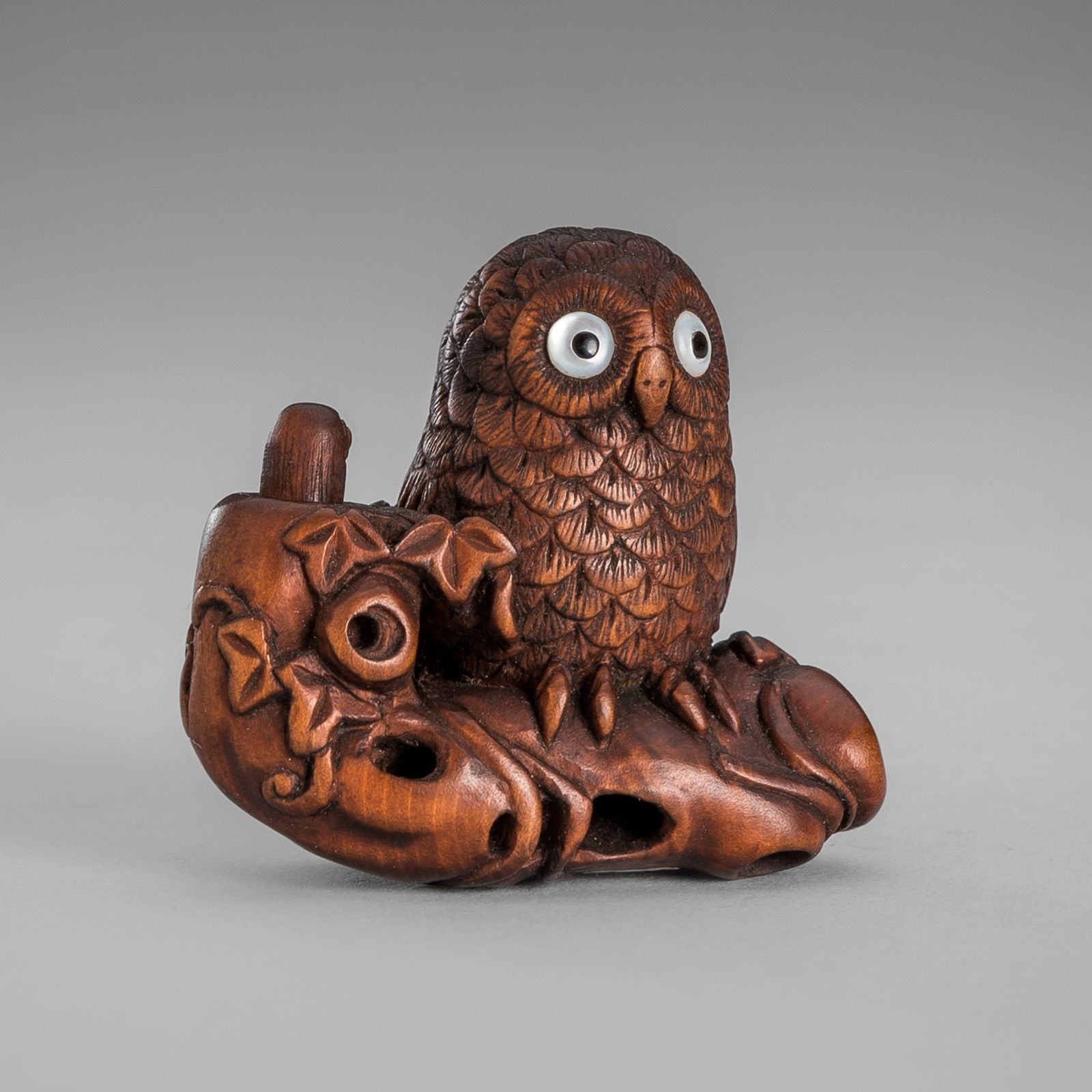 IKKYU: A WOOD NETSUKE OF AN OWL WITH A MOVABLE OWLET (1 of 14)