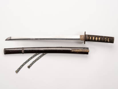 A WAKIZASHI IN KOSHIRAE: A WAKIZASHI IN KOSHIRAE Japan, Edo period (1615-1868)The blade:Of shinogi-zukuri with iori mune, the hamon is midare in nie-deki, the hada is ayasugi. The nakago with one mekugi ana, the tip