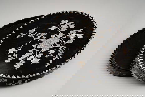 A KOREAN MOTHER OF PEARL INLAID LACQUER BOX, 19th CENTURY: A KOREAN MOTHER OF PEARL INLAID LACQUER BOX, 19th CENTURY Of circular form with a cover, lacquered dark born overall, the top of the cover inlaid in mother of pearl with a peony blossom borne o a leaf