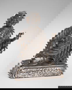 A SMALL BRONZE FIGURE OF AN ARHAT, 18TH-19TH CENTURY: A SMALL BRONZE FIGURE OF AN ARHAT, 18TH-19TH CENTURY Tibet. Seated in lalitasana upon a rectangular cushion incised with foliate designs, the hands held in vitarka mudra, dressed in long flowing