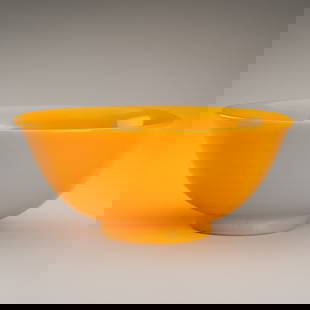 A PEKING YELLOW GLASS BOWL, QIANLONG MARK: A PEKING YELLOW GLASS BOWL, QIANLONG MARK China, Qing dynasty (1644-1912).The bowl with rounded sides rising from a short ring foot to a flared rim. With an incised four-character Qianlong Reign mark