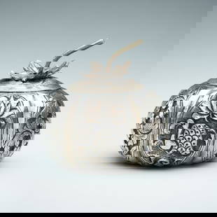 A LIDED GOURD-SHAPED SILVER MINIATURE BOX: A LIDED GOURD-SHAPED SILVER MINIATURE BOX South China / Vietnam, 1880s &#8211; 1920s. The gourd-shaped box finely embossed and incised with various mythical creatures and flower arrangements within lo