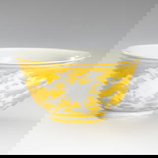 A YELLOW GLAZED PORCELAIN BOWL WITH LOTUS, c. 1900s: A YELLOW GLAZED PORCELAIN BOWL WITH LOTUS, c. 1900s China, late Qing Dynasty (1644-1912) to Republic period (1912-1949). Delicately potted, rising from a circular foot to an everted rim, painted in eg