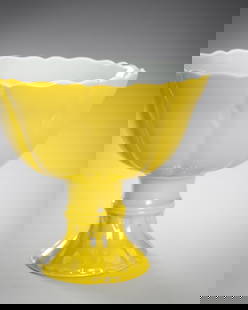 A LEMON-YELLOW GLAZED PORCELAIN STEM CUP, c. 1900s: A LEMON-YELLOW GLAZED PORCELAIN STEM CUP, c. 1900s China, late Qing Dynasty (1644-1912) to Republic period (1912-1949). The bowl molded in the form of a lotus with scalloped rims, raised on a tall spr