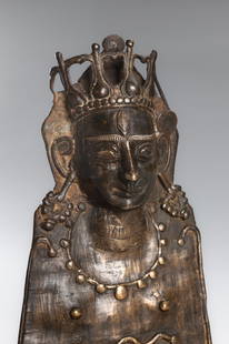 A BRONZE PAHARI STYLE MOHRA OF SHIVA, HIMACHAL PRADESH, 19TH CENTURY OR EARLIER: A BRONZE PAHARI STYLE MOHRA OF SHIVA, HIMACHAL PRADESH, 19TH CENTURY OR EARLIER Northern India. The rounded face with full lips in a smile, almond-shaped eyes and diamond-shaped urna surmounted with a