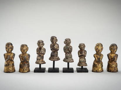 A GROUP OF EIGHT BRONZE DEVOTEES, BURMA, 19th CENTURY: A GROUP OF EIGHT BRONZE DEVOTEES, BURMA, 19th CENTURY Burma, 19th century. The group comprising of two female and six male figures, each seated kneeling on a cushion, the hands folded in adoration as