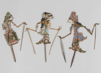 A GROUP OF THREE WAYANG KULIT SHADOW PUPPETS: A GROUP OF THREE WAYANG KULIT SHADOW PUPPETS Indonesia, early 20th century. The group including a Bathara Indra, the god of the heavens, thunder and storms, with his turban-like, spirally-twisted head
