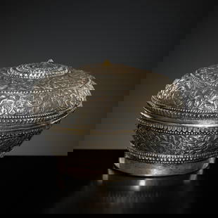 A SILVER REPOUSSÉ BETEL-NUT BOX AND COVER, 19TH-EARLY 20TH CENTURY: A SILVER REPOUSS&#201; BETEL-NUT BOX AND COVER, 19TH-EARLY 20TH CENTURY  This lot is a museum deaccession and is therefore offered without reserve Southeast Asia, probably Thailand or Burma, Shan and