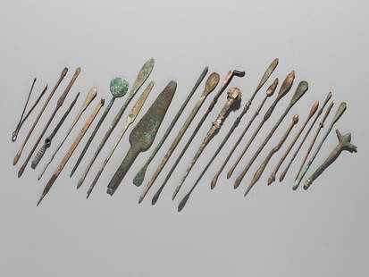 A GROUP OF TWENTY-FOUR GREEK AND ROMAN BRONZE PINS, SPOONS AND TOOLS, 1ST MILLENNIUM AD AND EARLIER: A GROUP OF TWENTY-FOUR GREEK AND ROMAN BRONZE PINS, SPOONS AND TOOLS, 1ST MILLENNIUM AD AND EARLIER  This lot is a museum deaccession and is therefore offered without reserve Europe and Western Asia.
