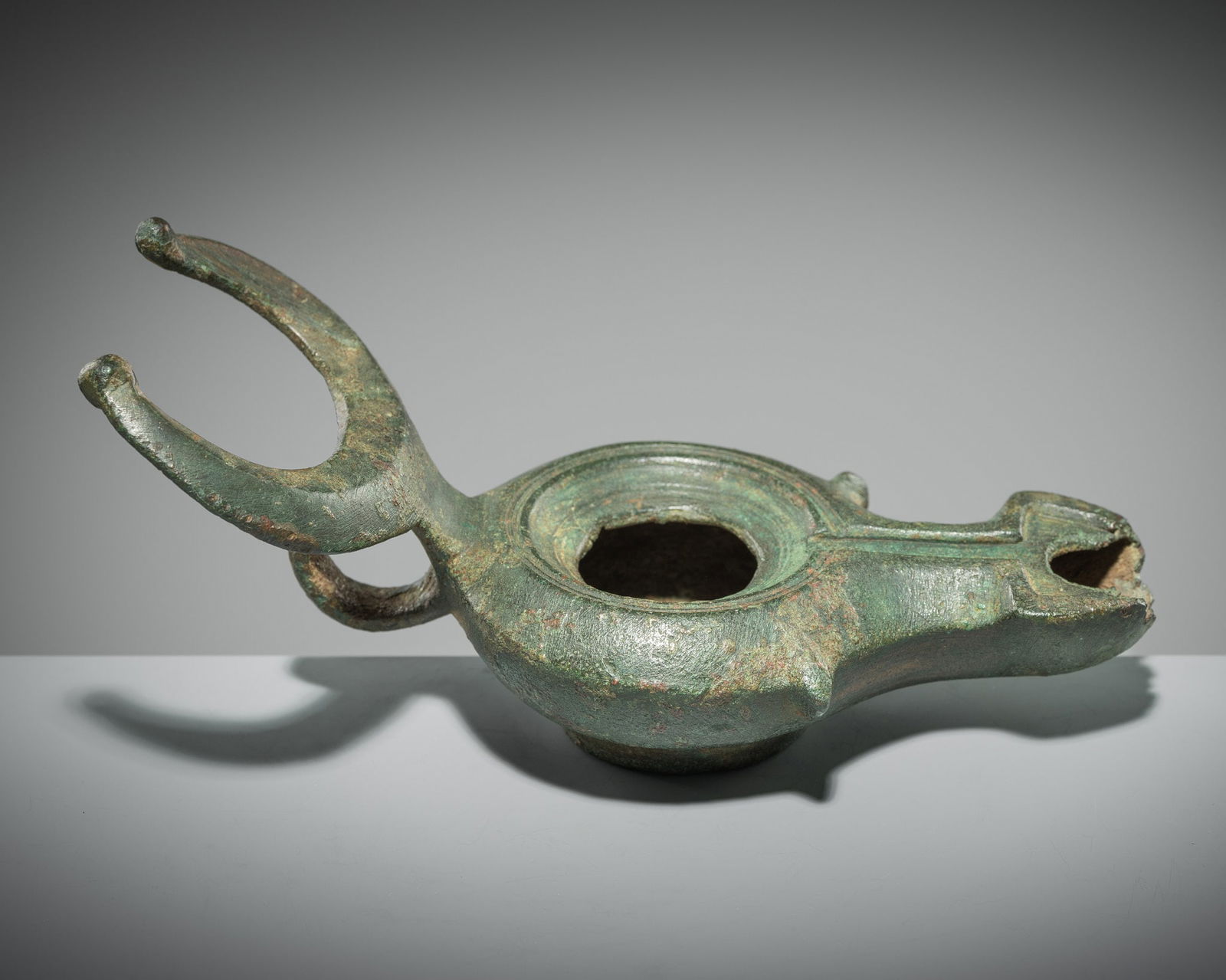 A ROMAN BRONZE 'BULL' LAMP, CIRCA 1ST-2ND CENTURY AD (1 of 17)