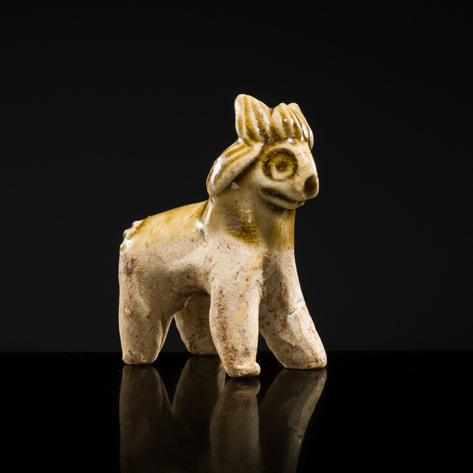 A MOTTLED YELLOWISH-WHITE GLAZED MINIATURE FIGURE OF A GOAT, SONG DYNASTY (1 of 8)
