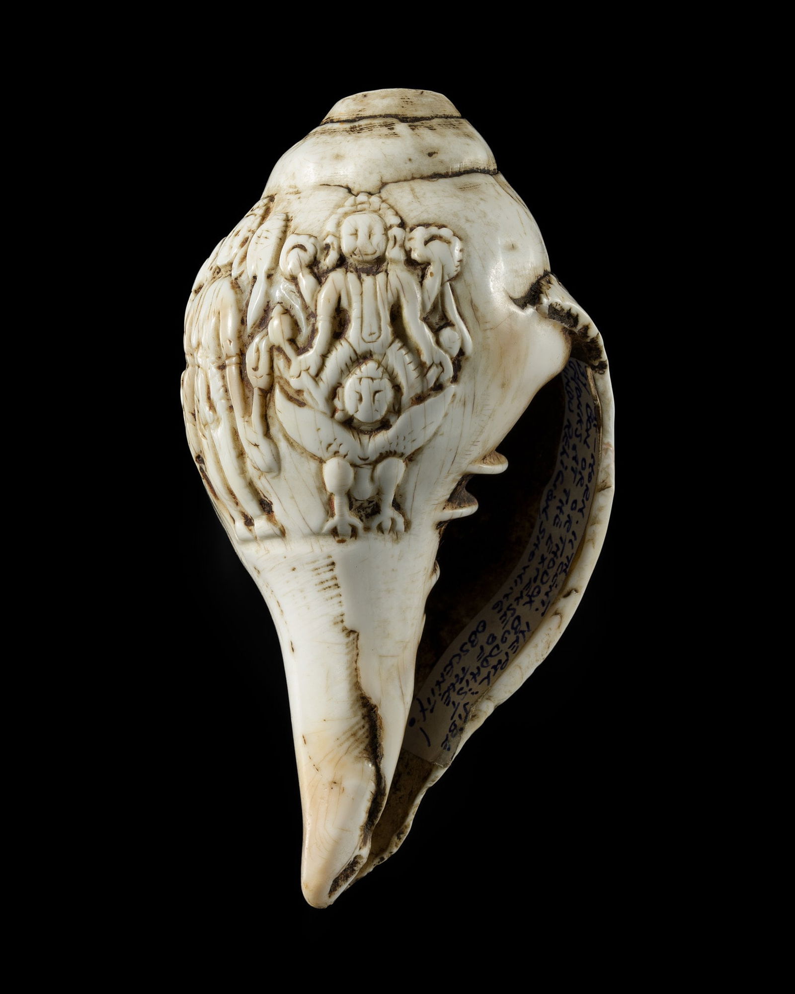 A RITUAL CONCH SHELL DEPICTING VISHNU AND GARUDA, NEPAL, 11TH CENTURY (1 of 14)