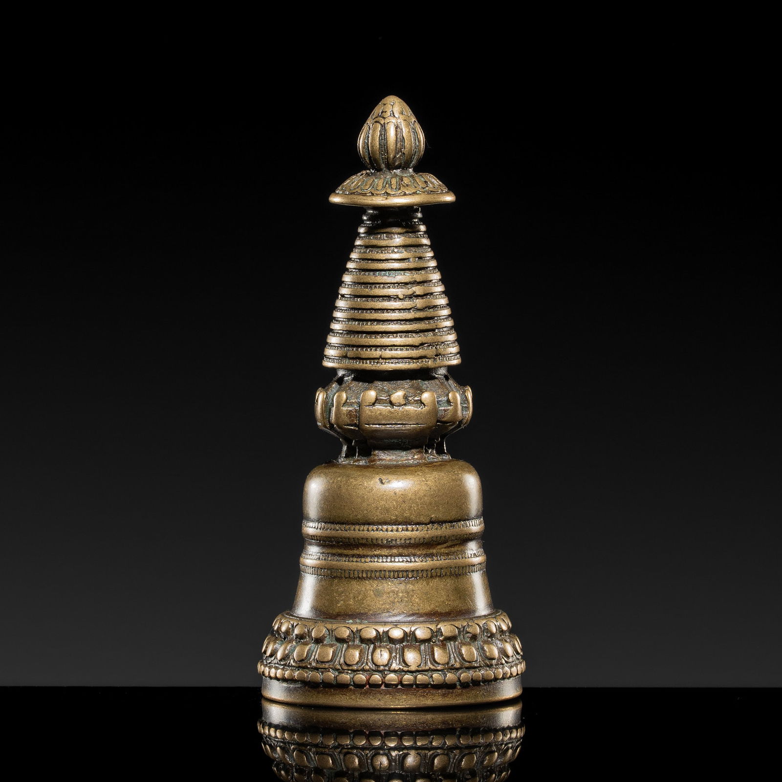 A BRONZE STUPA, TIBET, KADAMPA STYLE, CIRCA 13TH CENTURY
