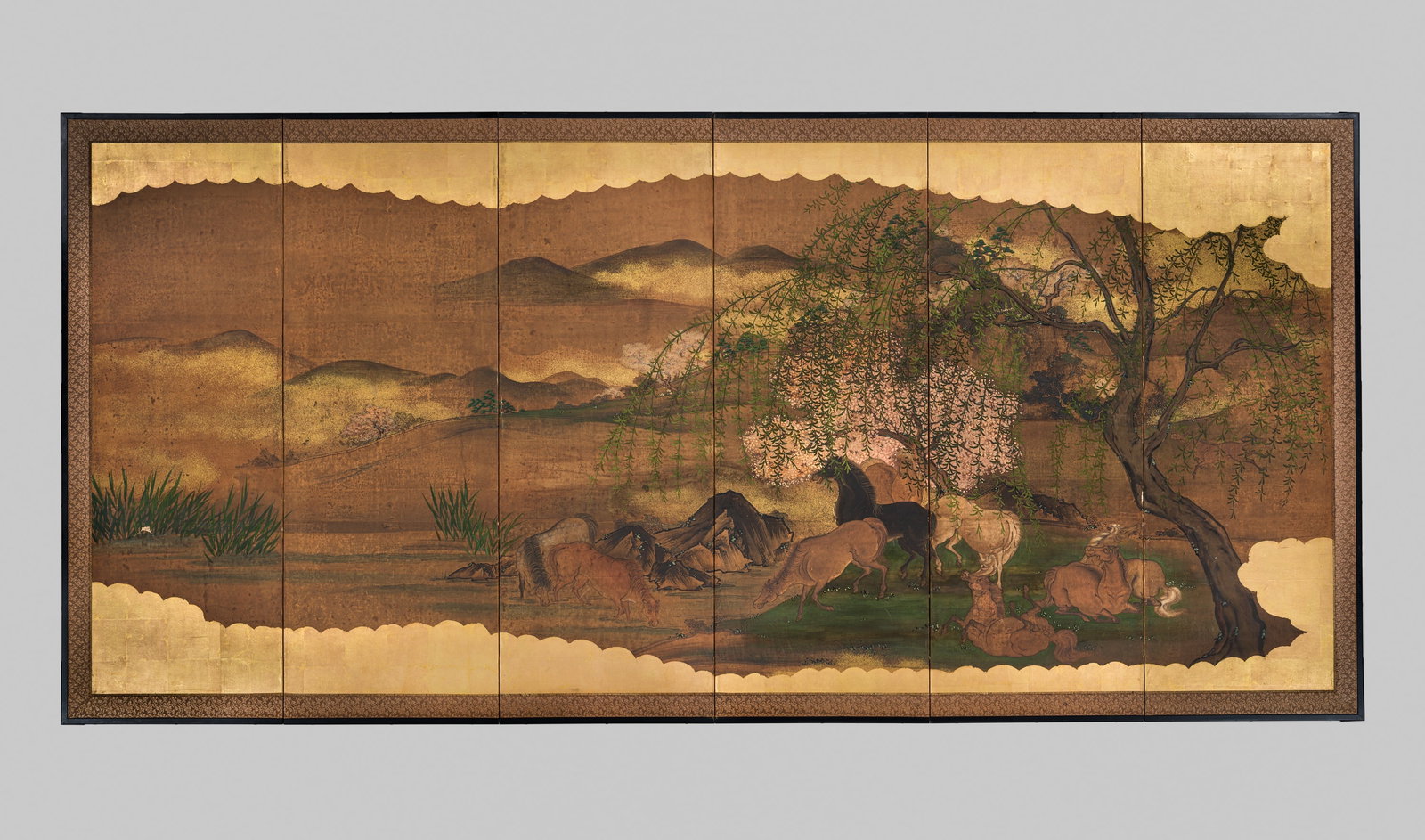 A KANO SCHOOL SIX-PANEL BYOBU (FOLDING SCREEN) DEPICTING GRAZING HORSES IN A LANDSCAPE (1 of 7)