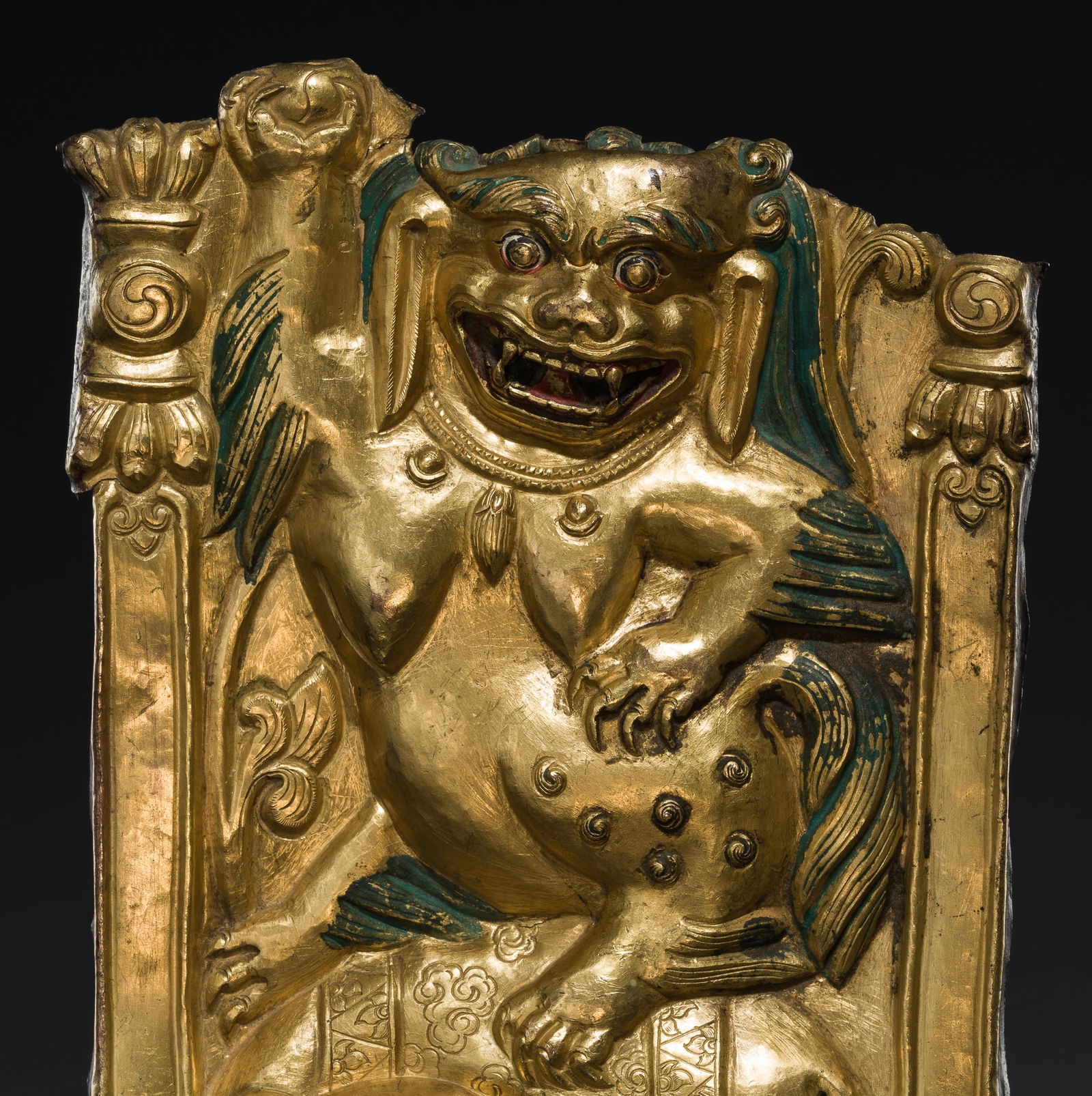 A GILT COPPER REPOUSSÉ 'LION AND ELEPHANT' PANEL, TIBET, 17TH-18TH CENTURY (1 of 9)