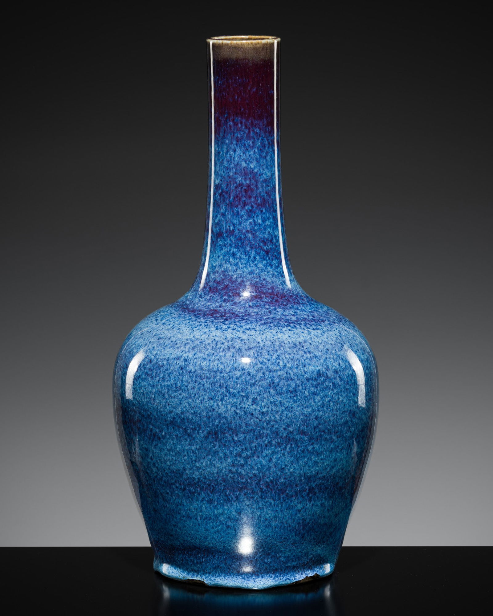 A FLAMBÉ GLAZED BOTTLE VASE, QING DYNASTY (1 of 14)