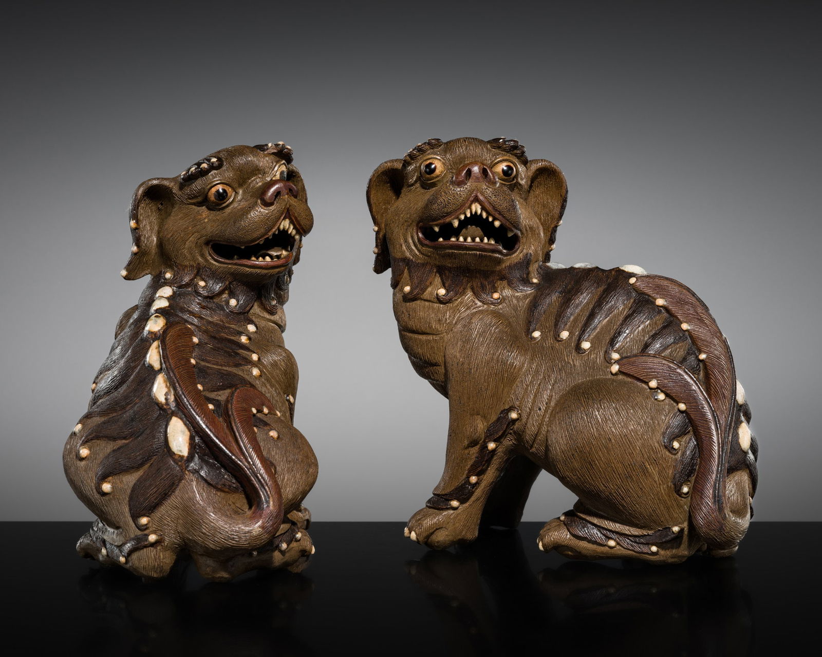 AN UNUSUAL PAIR OF SHIWAN STONEWARE BUDDHIST LIONS, 19TH CENTURY (1 of 10)