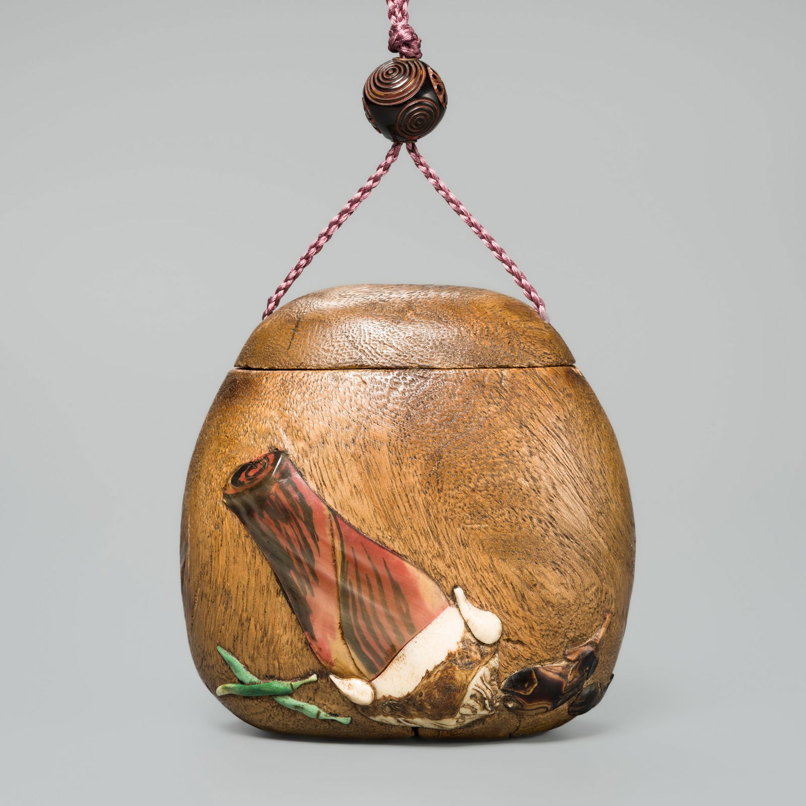 A LARGE INLAID KIRI WOOD TONKOTSU (TOBACCO CONTAINER) DEPICTING VEGETABLES (1 of 11)