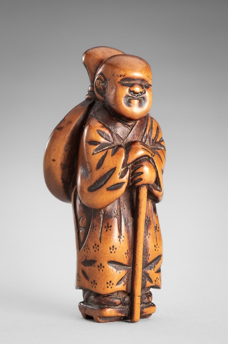 A SIGNED WOOD NETSUKE OF A KOKYU PLAYER (1 of 13)