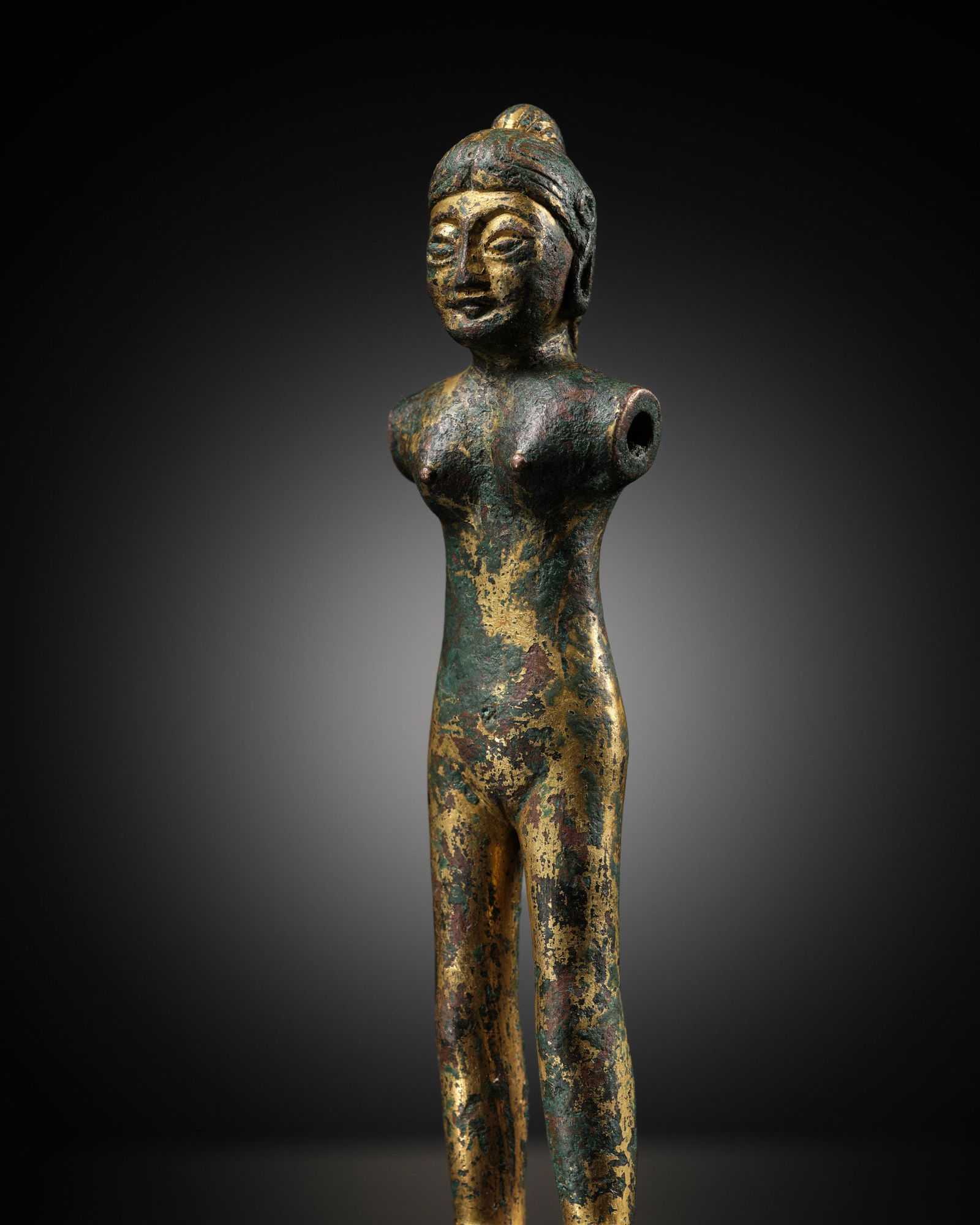 A SMALL GILT-BRONZE FIGURE OF A WOMAN, WESTERN HAN DYNASTY (1 of 13)