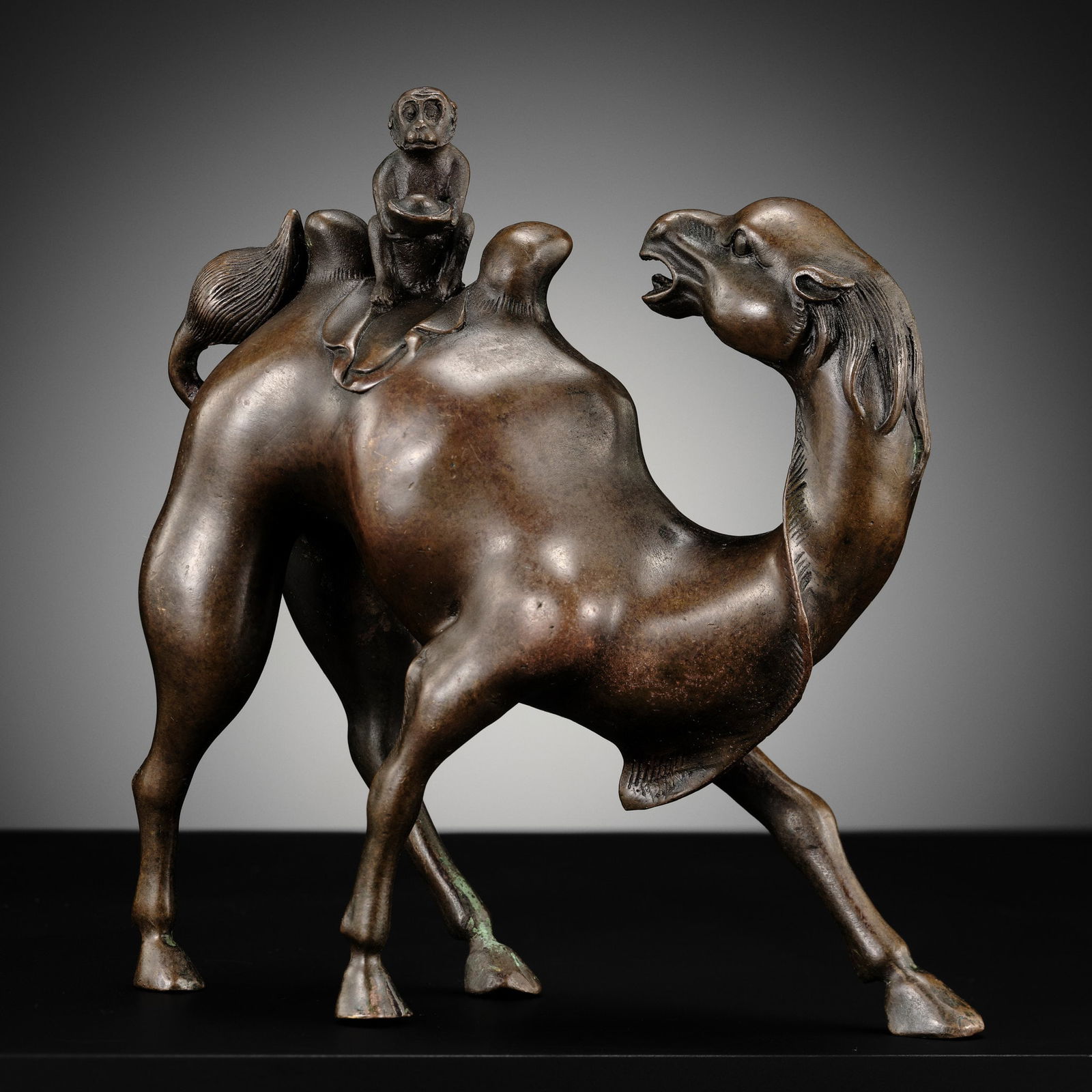 AN AMUSING BRONZE GROUP OF A MONKEY RIDING A CAMEL, LATE QING DYNASTY TO REPUBLIC PERIOD (1 of 13)
