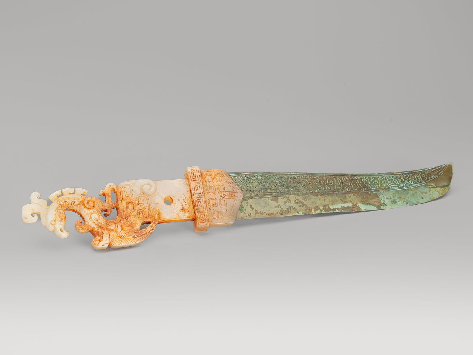 AN ARCHAISTIC WHITE AND RUSSET JADE-INSET BRONZE CEREMONIAL SWORD, SHANG-STYLE (1 of 14)