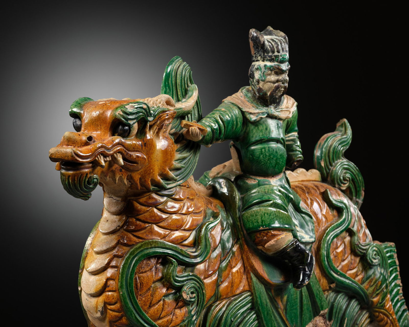 A MASSIVE IMPERIAL SANCAI GLAZED 'DRAGON AND IMMORTAL RIDER' ROOF TILE, MING DYNASTY: A MASSIVE IMPERIAL SANCAI GLAZED 'DRAGON AND IMMORTAL RIDER' ROOF TILE, MING DYNASTY Published: Alice R. M. Hyland, Passion and Pursuit: The Billings Collection, Nantucket, 2002, p. 128-129, no. 251.