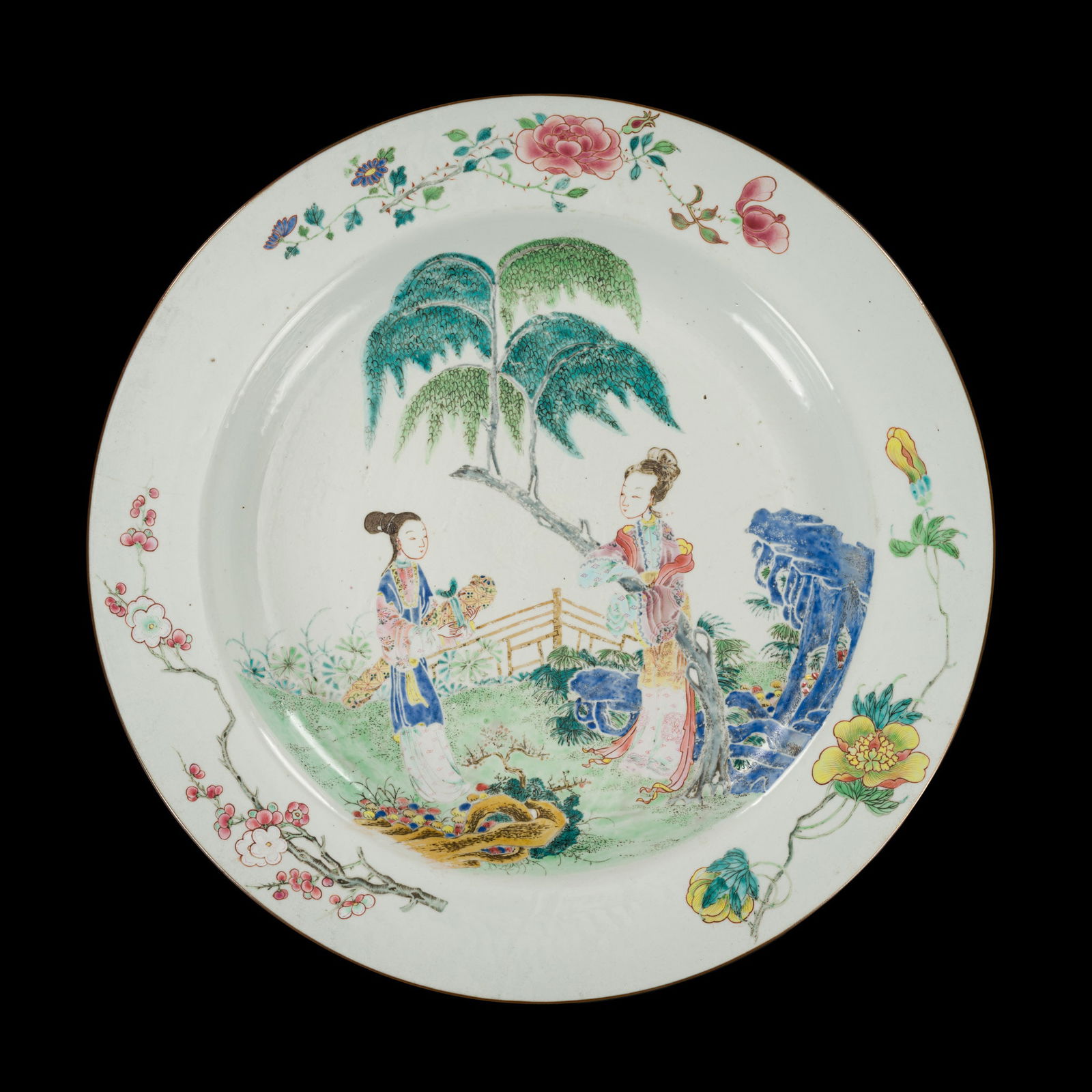A LARGE FAMILLE ROSE DISH WITH LADIES, YONGZHENG PERIOD: A LARGE FAMILLE ROSE DISH WITH LADIES, YONGZHENG PERIOD China, 1730-1735. Heavily potted with shallow rounded sides rising from a short foot to a broad everted rim, the exterior finely decorated in br