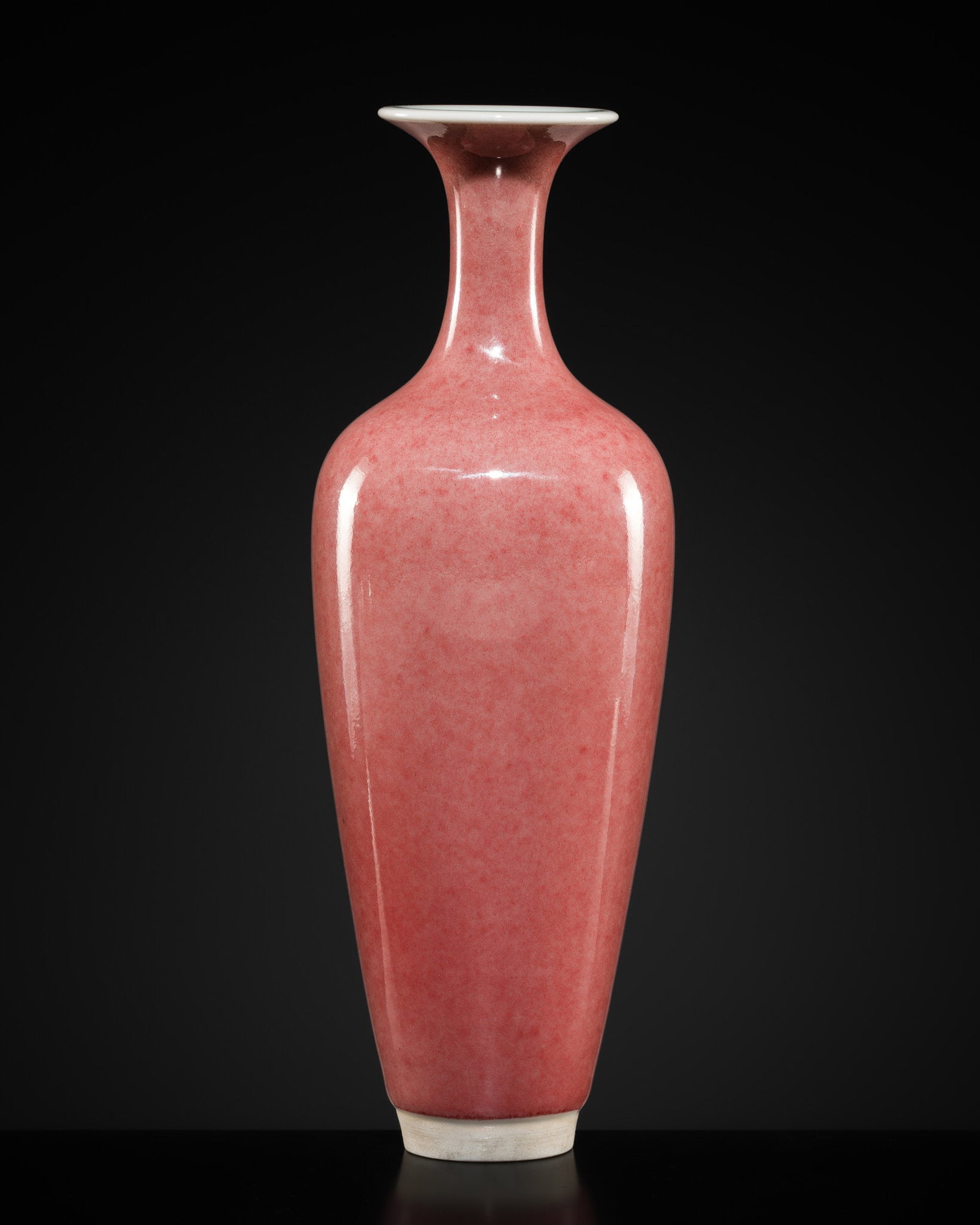 A PEACHBLOOM-GLAZED AMPHORA VASE, LIUYEPING, 20TH CENTURY OR EARLIER: A PEACHBLOOM-GLAZED AMPHORA VASE, LIUYEPING, 20TH CENTURY OR EARLIER China. The slender vessel tapering towards the foot and surmounted by a delicate trumpet neck, covered all over with a mottled pink